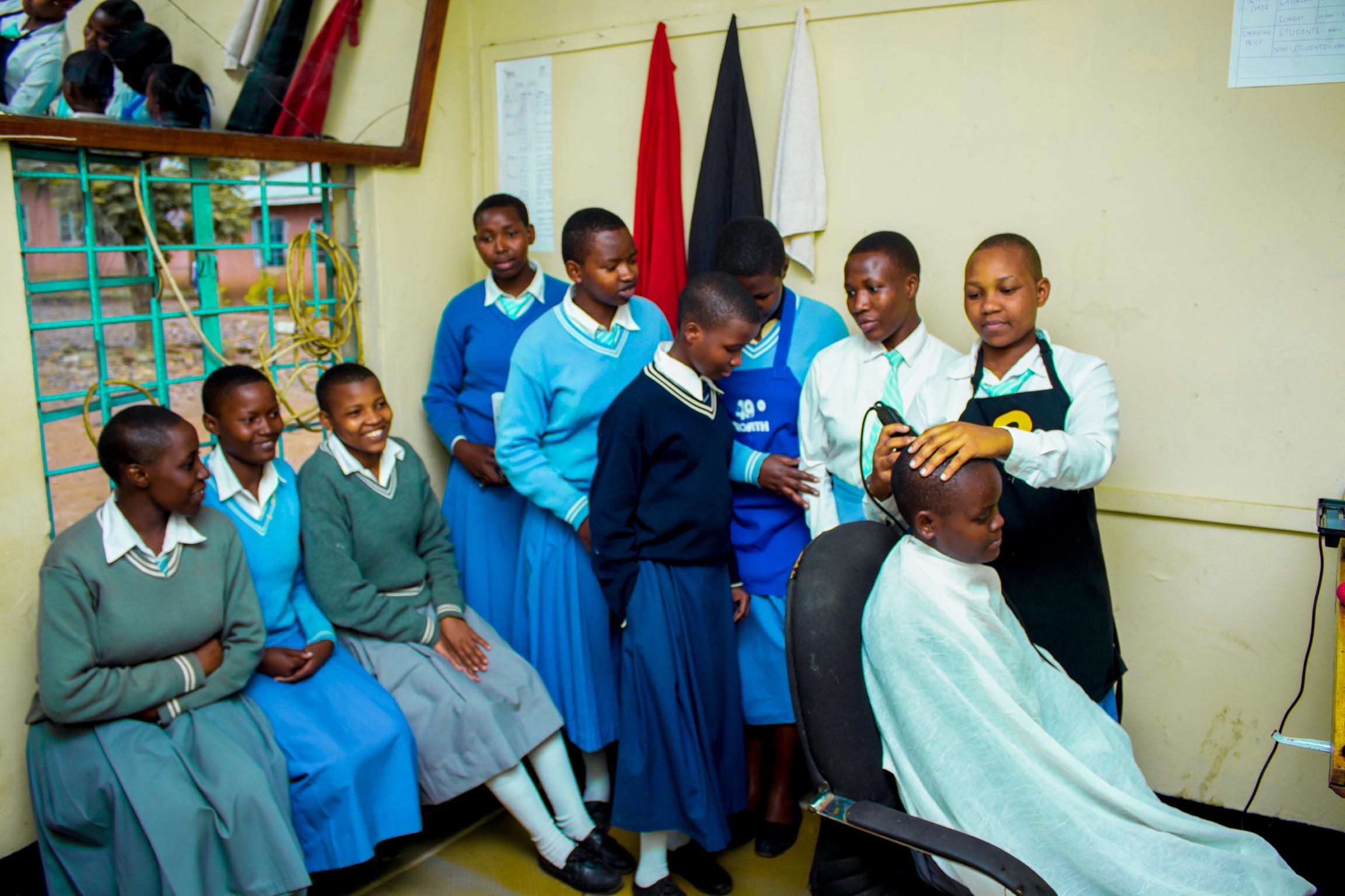 Students working in their school hair salon business